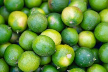 Close-up Of green lime for sale at local market.