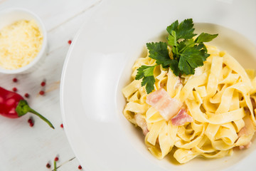 Carbonara pasta, spaghetti, parmesan cheese and cream sauce. Traditional italian cuisine. Pasta alla carbonara
