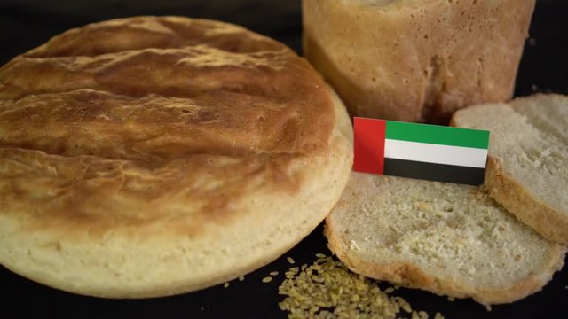 Bread with flag of United Arab Emirates. World wheat import export trade