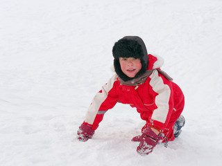 Fototapeta na wymiar Winter fun. children ride from a snow hill.