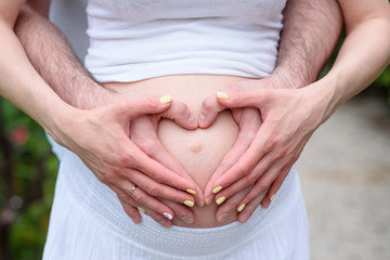 new life birth concept happy woman pregnancy female holding hands symbol heart white background selective focus.
