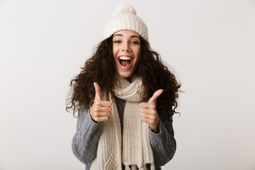 Happy young woman wearing winter clothes