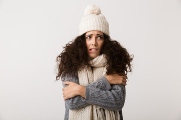 Upset young woman wearing winter scarf