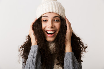 Happy young woman wearing winter clothes