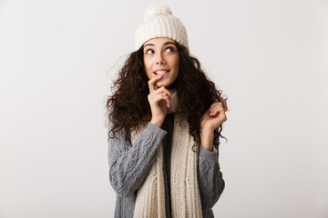 Happy young woman wearing winter clothes