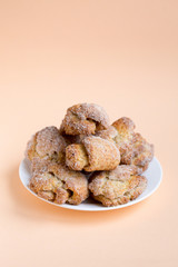 Cottage cheese buns on coral color background