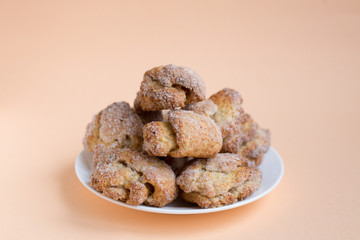 Cottage cheese buns on coral color background