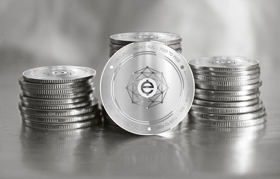 Exchange Union (XUC) digital crypto currency. Stack of silver coins. Cyber money.