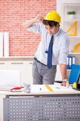 Construction supervisor working on blueprints