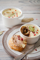 Homemade Pâté baked in terrine made from chicken liver, with pink pepper and province herbs.