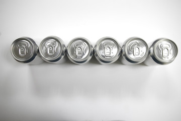 Cans of sweet drinks (or beer) soda cans
