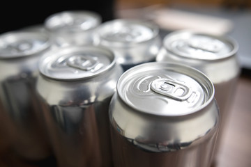 Cans of sweet drinks (or beer) soda cans