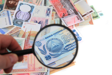 money different banknotes with magnify glass
