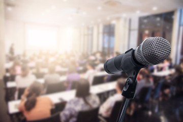 Microphone over the blurred business people forum Meeting or Conference Training Learning Coaching Room Concept, Blurred background.