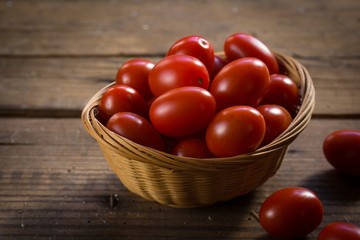 Still life fresh cherry tomatoes in a basket, selective focus