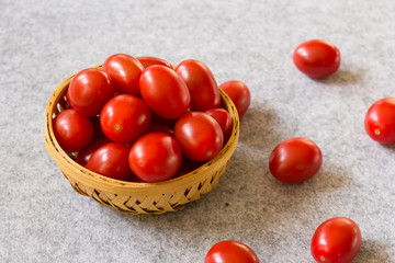 Still life fresh cherry tomatoes in a basket, selective focus