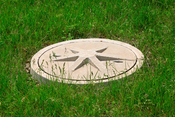 Cement covers in the lawn