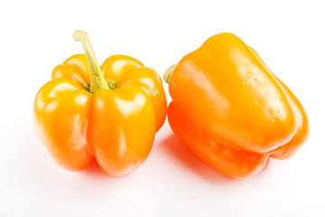 two yellow sweet peppers isolated on white background.