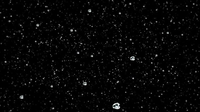 Rain and raindrops falling at a black backdrop 4k footage