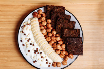 Closeup of plate with healthy food, Breakfast on wooden background, top view