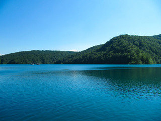 Beautiful landscape with views of the two River boat floating on the lake in the national Park Plitvice lakes, Croatia.
