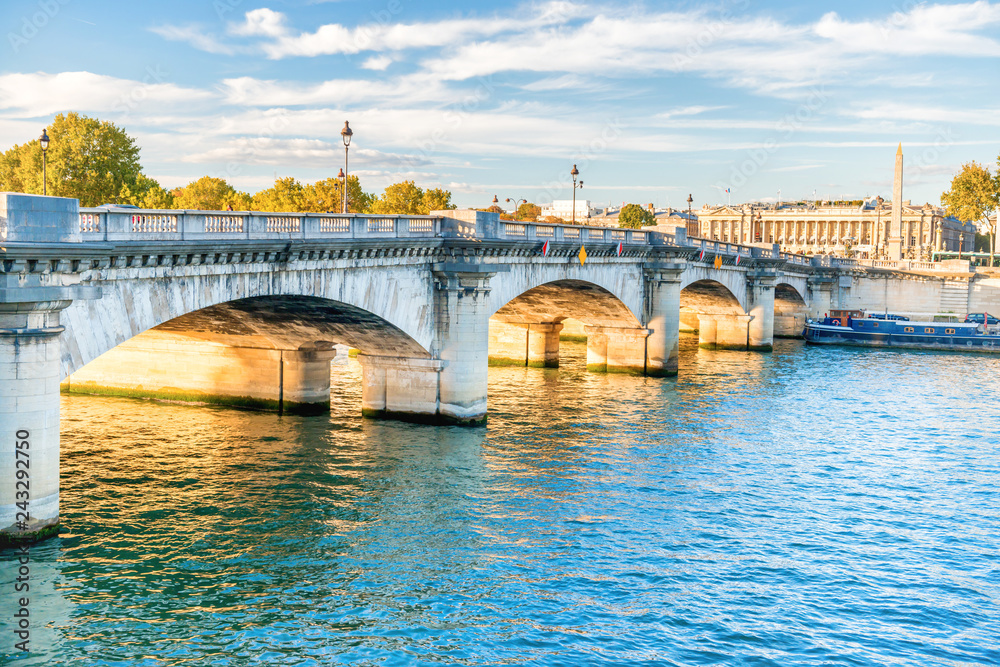 Wall mural Old stone bridge across Seine river in Paris