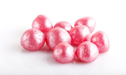 Heap of pink hard sugar candies.
