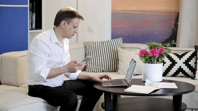 Handsome man working from home