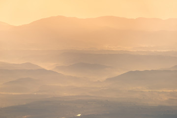 Obraz premium Beautiful mountain and morning sunrise over the sea of mist. Mon Sone View point , Doi Pha Hom Pok National Park in Chiang Mai,Thailand.