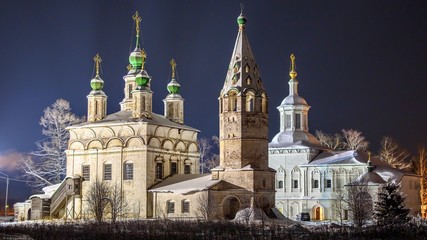 Fototapeta na wymiar Winter night view ensemble of ancient orthodox churches in Veliky Ustyug