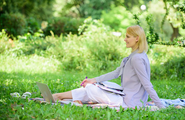 Business lady freelance work outdoors. Remote job concept. Managing business remote outdoors. Woman with laptop sit grass meadow. Best jobs to work remotely. Stay free with remote job