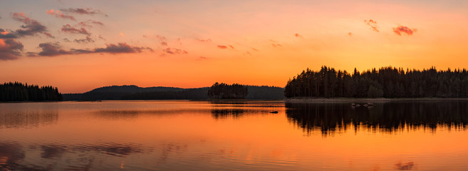 Golden lake sunset panorama / Panoramic view with golden lake sunset in Rhodope Mountains, Bulgaria - Powered by Adobe
