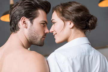 adult couple smiling and looking into eyes