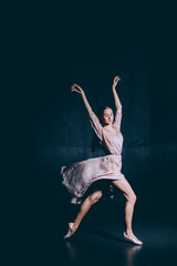 Fototapeta na wymiar Ballerina in the rehearsal room rehearsing dance