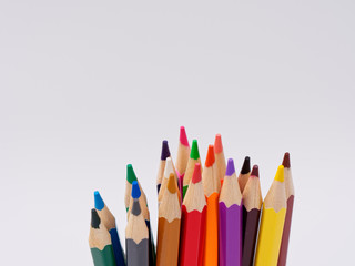 colored pencils sharpened on a white background.