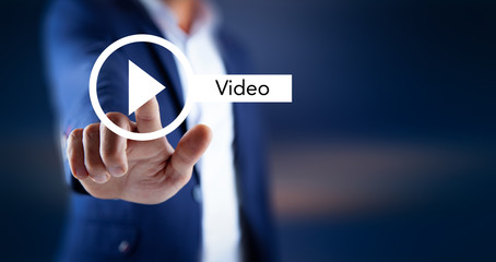 man touching video sign