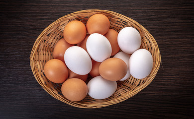 chicken eggs in a wicker bowl