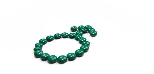 Symbol für männlich aus Tabletten gelegt