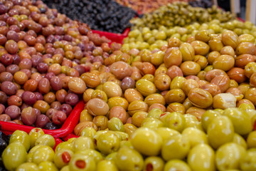 Green and black olives on market