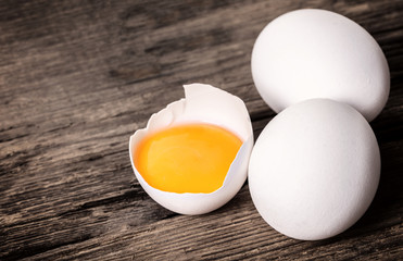 broken and whole chicken eggs