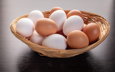 chicken eggs in a wicker bowl