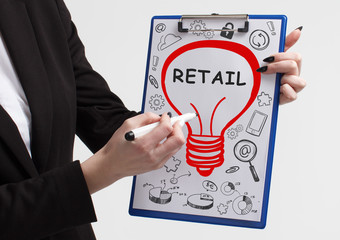 Business, technology, internet and networking concept. Young entrepreneur showing keyword: Retail