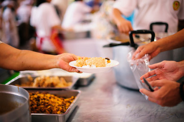 Feeding Food To Poor, Using leftovers to feed the hungry : concept serving free food to the poor