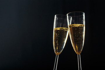 Champagne glasses for festive occasion against a dark background