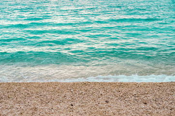 Obraz premium Sea surf on a stony beach.