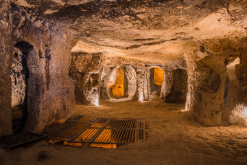 Explore Kaymakli underground city in Cappadocia, Turkey. - obrazy, fototapety, plakaty