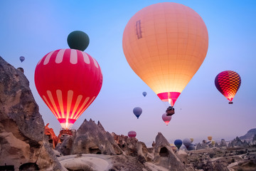 Close-up big air balloons flying over Cappadocia landscape at sunrise