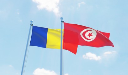 Tunisia and Romania, two flags waving against blue sky. 3d image