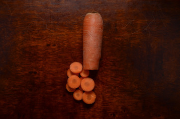 Carrot on wooden table. Healthy organic orange vegetable food carrot is single in the kitchen with text of on background 