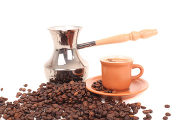 Turk and coffee cup on a white background